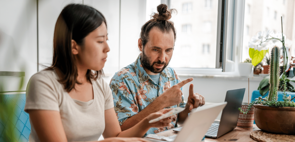 Image of couple working out mortgage rates