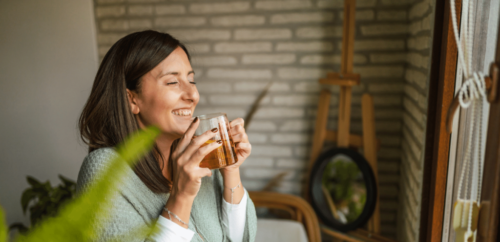 Picture of a happy person drinking coffee