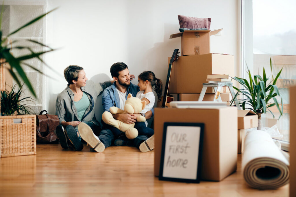 Illustration showing a family with a new house key, representing the government's First Home Grant program.